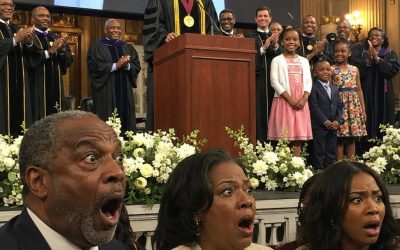 My father refused to let me attend my own medical school graduation because my stepmother wanted my VIP ticket for her daughter. He laughed in my face, called me insignificant, and shoved me out into the pouring rain while they walked inside to celebrate what they thought was someone else’s achievement.  What they didn’t know was that I wasn’t just another graduate.  I was the valedictorian.  The keynote speaker.  And the recipient of the university’s most prestigious research award.  The moment the Dean stepped onto the stage and announced the guest of honor, my family’s smiles disappeared instantly.  The night before graduation, I came home after a demanding shift at the hospital.  My body ached from exhaustion.  All I wanted was a shower and a few hours of sleep.  Instead, my stepmother’s voice greeted me the second I walked through the door.  “Clara, those dishes aren’t going to clean themselves. Haley has a photoshoot tomorrow, and I don’t want this place looking messy.”  My father sat on the couch scrolling through his tablet.  He didn’t even glance in my direction.  Taking a deep breath, I pulled a gold-embossed envelope from my bag.  “Dad,” I said quietly. “Graduation is on Friday. I only received one VIP ticket, and I was hoping you could come.”  Before I could finish speaking, he grabbed the invitation from my hand.  For a moment, I thought he might actually read it.  Instead, he immediately handed it to my stepsister.  “There you go, Haley.”  I stared in disbelief.  “Dad?”  He rolled his eyes.  “Don’t be selfish, Clara. You’re just a nurse’s assistant. Nobody’s going to notice you. Haley can actually use this opportunity to meet influential people.”  Haley grinned as she examined the ticket.  “VIP access? This is amazing!”  I stood there speechless.  For four years, I had hidden the truth.  The long nights.  The scholarships.  The research projects.  The honors.  None of them ever bothered asking what I was actually doing at medical school.  And eventually, I stopped telling them.  Graduation morning arrived under dark storm clouds.  Rain hammered the campus as students hurried toward the ceremony hall.  I stood near the entrance, soaked and shivering.  Then a luxury taxi pulled up to the VIP entrance.  Out stepped my family.  Haley immediately flashed the gold invitation.  “This is going to look incredible on social media,” she said excitedly.  I took a step toward the doors, intending to enter with the graduating class.  But suddenly my father grabbed my arm.  Firmly.  “What do you think you’re doing?” he snapped.  I winced.  “I’m going inside.”  “No, you’re not.”  He looked me up and down with obvious contempt.  “Look at yourself. You’re soaked. You’ll ruin Haley’s pictures.”  My stepmother nodded.  “Honestly, Clara, stop trying to make everything about you.”  “I’m graduating today,” I replied quietly.  Neither of them listened.  My father shoved me backward toward the rain-covered steps.  “You’re embarrassing us.”  Then they turned around and disappeared through the massive bronze doors without another word.  Leaving me standing alone in the storm.  For years, they treated me like an afterthought.  A disappointment.  A burden.  Someone who would never amount to much.  I wiped the rain from my face and considered leaving.  Then suddenly the rain stopped falling on me.  Confused, I looked up.  A large black umbrella hovered overhead.  Standing beside me was Dean Jonathan Bradley, head of the university’s medical board.  Dressed in full academic regalia, he looked completely stunned.  “Dr. Hensley?” he exclaimed.  I blinked.  The Dean looked genuinely alarmed.  “Why are you standing outside?”  Before I could answer, he continued.  “The Board of Trustees has been searching everywhere for you. The ceremony starts in minutes, and you’re scheduled to deliver the valedictorian address.”  My heart skipped.  The Dean wasn’t finished.  “The donors, faculty, and research committee are all waiting. We still need to present your scholarship award before the speech.”  For the first time all morning, I smiled.  Because inside that auditorium, my father and stepmother were proudly sitting in VIP seats they had stolen from me.  Completely unaware that the entire ceremony was about to revolve around the daughter they spent years dismissing… (I know you’re all very curious about the next part, so if you want to read more, please leave a “YES” comment below!)👇👇