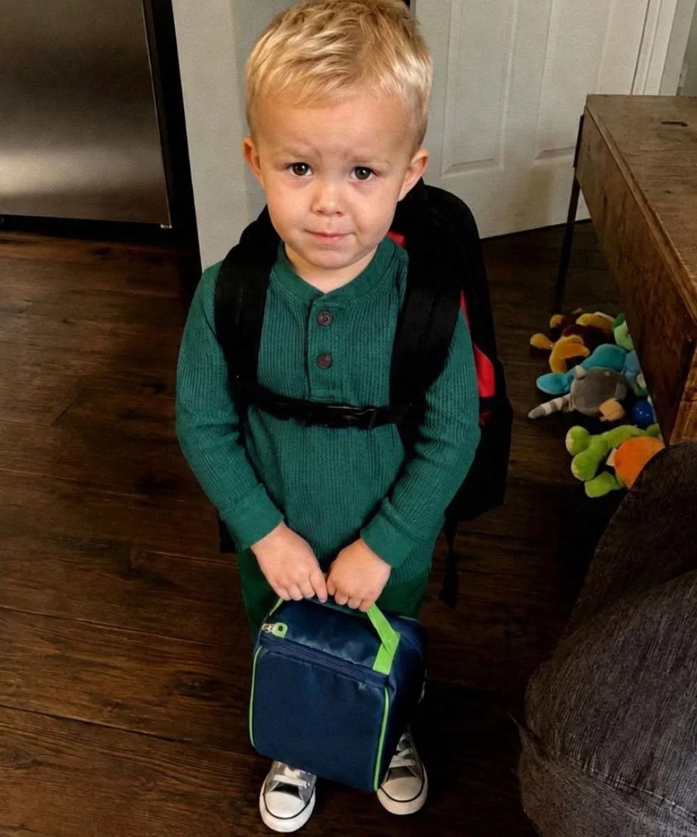 Every morning before the sun came up, I packed his small lunchbox, kissed his hair, and repeated the same reminder before school.  “Eat it all, okay? You’re growing.”  He would nod, wrap his little arms around me, then hurry toward the bus with his backpack bouncing behind him.  Money had been difficult for months, but I always made sure Noah had something to eat.  Some days, it was nothing fancy.  A sandwich. An apple. A few crackers. Whatever I could stretch from that week’s groceries.  But I believed one thing with my whole heart.  My son never went to school hungry.  At least, that was what I told myself.  Then, one Friday afternoon, his teacher called.  Her tone was kind, but there was something in her voice that made my stomach twist.  “Mrs. Miller, could you come in today? I need to speak with you about Noah.”  “Is he in trouble?” I asked quickly.  “No,” she replied. “Not really. It’s about his lunch.”  I went still.  “His lunch?”  She hesitated.  Then she asked the question that made my blood run cold.  “Do you know why Noah keeps arriving with an empty lunchbox?”  For a moment, I couldn’t answer.  “That’s not possible,” I said. “I pack his lunch every single morning.”  That same day, I rushed to pick Noah up from baseball practice.  The second he climbed into the car, I asked him gently but firmly.  “Sweetheart, has someone been taking your lunch?”  Noah’s face turned pale.  He shook his head.  “No,” he whispered.  I gripped the steering wheel, forcing myself to stay calm.  “Then what happened to it, baby?”  He looked down at his sneakers.  His small fingers twisted the strap of his backpack until his knuckles turned white.  And when he finally told me the truth, I felt my whole world stop. Full story in 1st comment 👇