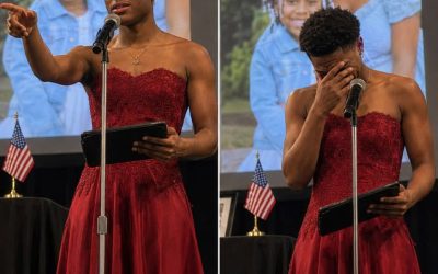 My Son Walked Across the Graduation Stage in a Bright Red Dress While the Auditorium Giggled — He Did It for Me. And I Begged Him Not To The whispering started the moment he stepped onstage. Then the giggles spread backward, row by row, through the auditorium. “What is wrong with that guy?” a voice muttered from the back, not even trying to be quiet about it. Callum didn’t flinch. He shook the principal’s hand, took his diploma, and turned to face six hundred people laughing at him. I sat in the third row, the only person there who understood exactly why. Callum had a twin sister, Iris. Inseparable their whole lives. A few months before graduation, she got sick. Fast, aggressive, impossible to plan around. She died three weeks before the ceremony they were meant to walk across that stage together. Three days before she passed, she pulled him into her hospital room alone and gave him something small, wrapped in a letter. She asked him to promise her one thing. His father refused to attend once he heard the plan. His closest friend stopped answering his texts. The school called, gently suggesting something “more appropriate.” He wore it anyway. Now he was walking straight toward me, up the center aisle, past every whispering face in that room. He stopped in front of my seat. “This is for you,” he said. “Both of you.” He reached into the dress, pulled something small into view. And the second I saw it, the entire auditorium disappeared. If you want to read the full story, type OK in the comments below