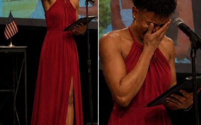 My Son Walked Across the Graduation Stage in a Bright Red Dress While the Auditorium Giggled — He Did It for Me. And I Begged Him Not To The whispering started the moment he stepped onstage. Then the giggles spread backward, row by row, through the auditorium. “What is wrong with that guy?” a voice muttered from the back, not even trying to be quiet about it. Callum didn’t flinch. He shook the principal’s hand, took his diploma, and turned to face six hundred people laughing at him. I sat in the third row, the only person there who understood exactly why. Callum had a twin sister, Iris. Inseparable their whole lives. A few months before graduation, she got sick. Fast, aggressive, impossible to plan around. She died three weeks before the ceremony they were meant to walk across that stage together. Three days before she passed, she pulled him into her hospital room alone and gave him something small, wrapped in a letter. She asked him to promise her one thing. His father refused to attend once he heard the plan. His closest friend stopped answering his texts. The school called, gently suggesting something “more appropriate.” He wore it anyway. Now he was walking straight toward me, up the center aisle, past every whispering face in that room. He stopped in front of my seat. “This is for you,” he said. “Both of you.” He reached into the dress, pulled something small into view. And the second I saw it, the entire auditorium disappeared. If you want to read the full story, type OK in the comments below